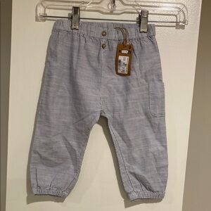 NWT Newbie Infant Striped Blue Pants with
Elastic waist and cuffs. 9-12 months